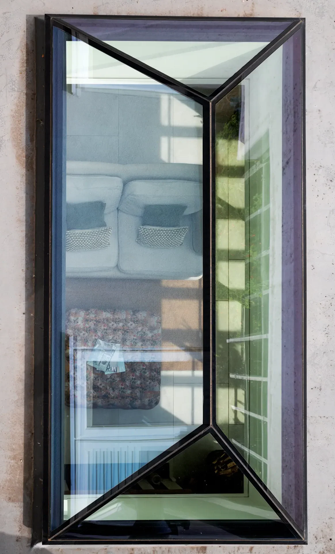 A picture from above of a glass roof lantern installed in a kitchen extension.
